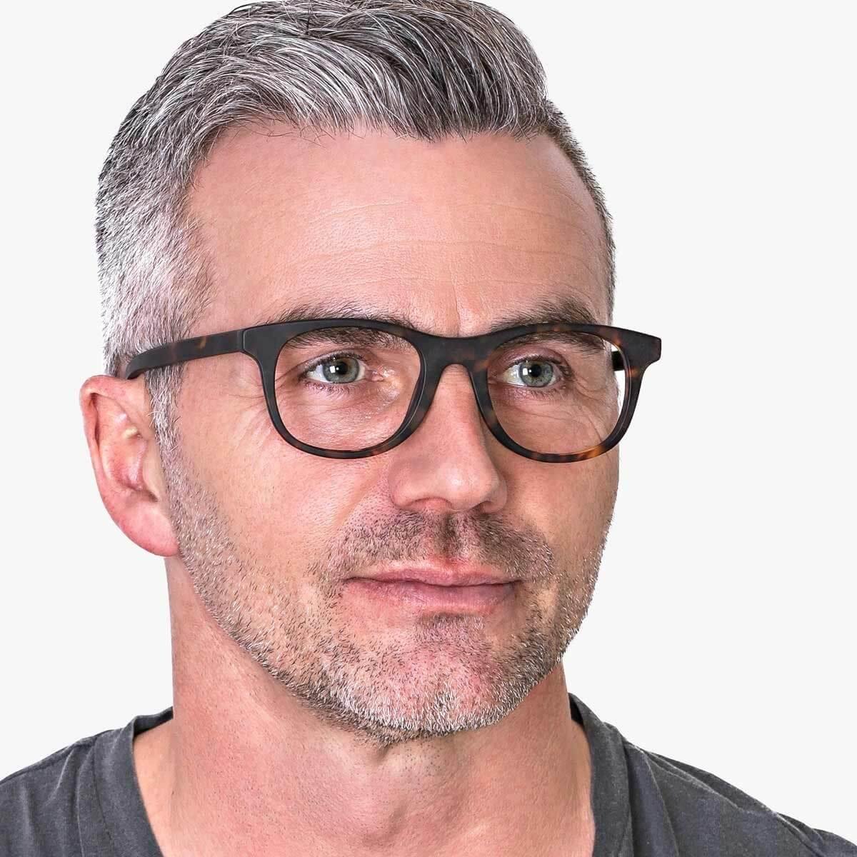 Person wearing Malmö Dark Turtle glasses