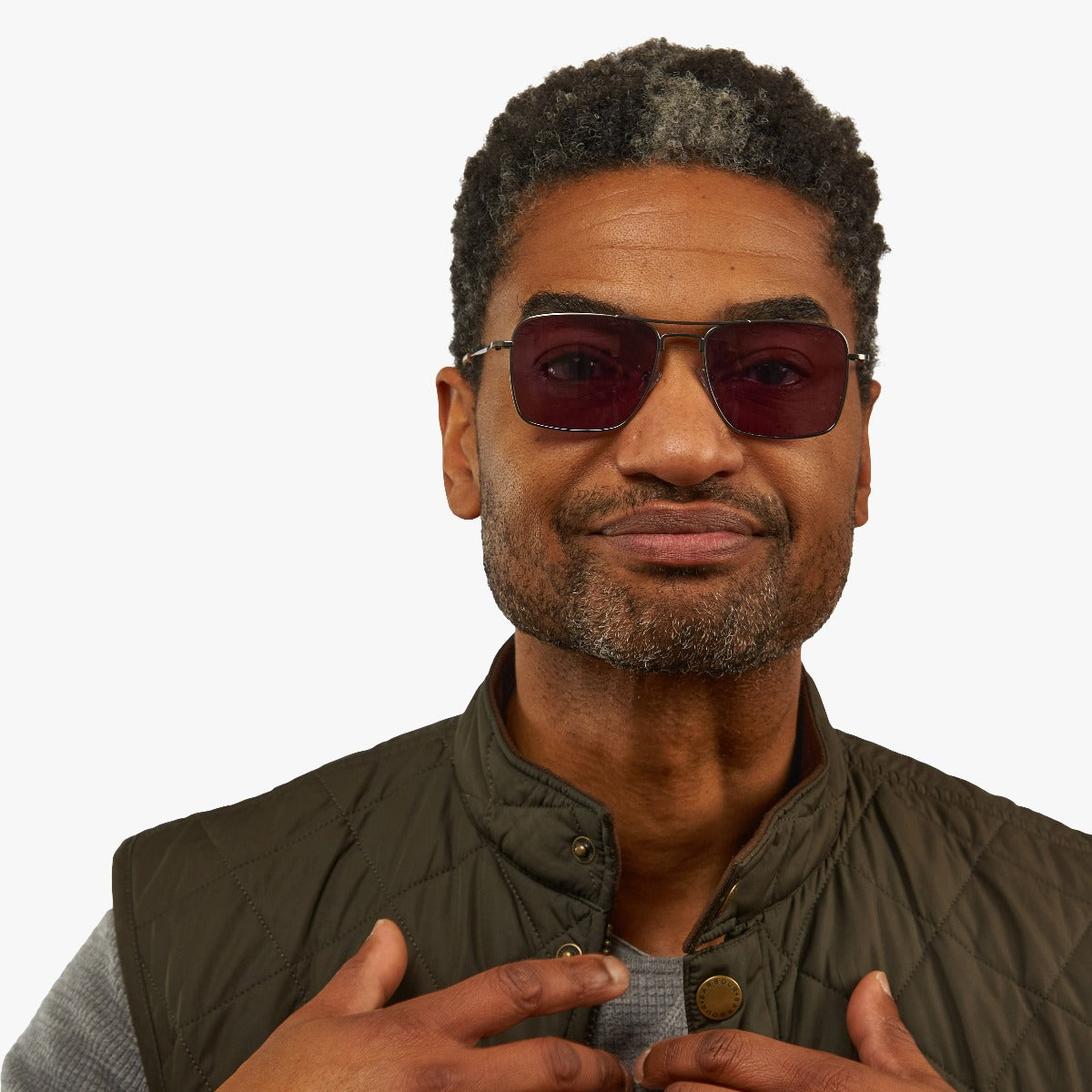 Person wearing men's Lidköping Gun sunglasses with dark lenses