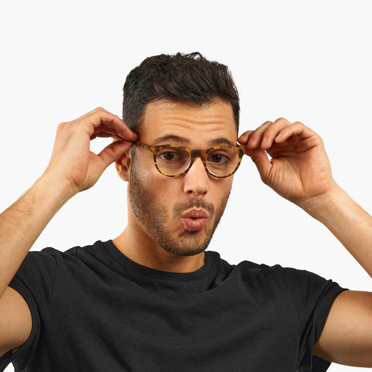 Person wearing Men's Örebro Light Turtle glasses in tortoise pattern