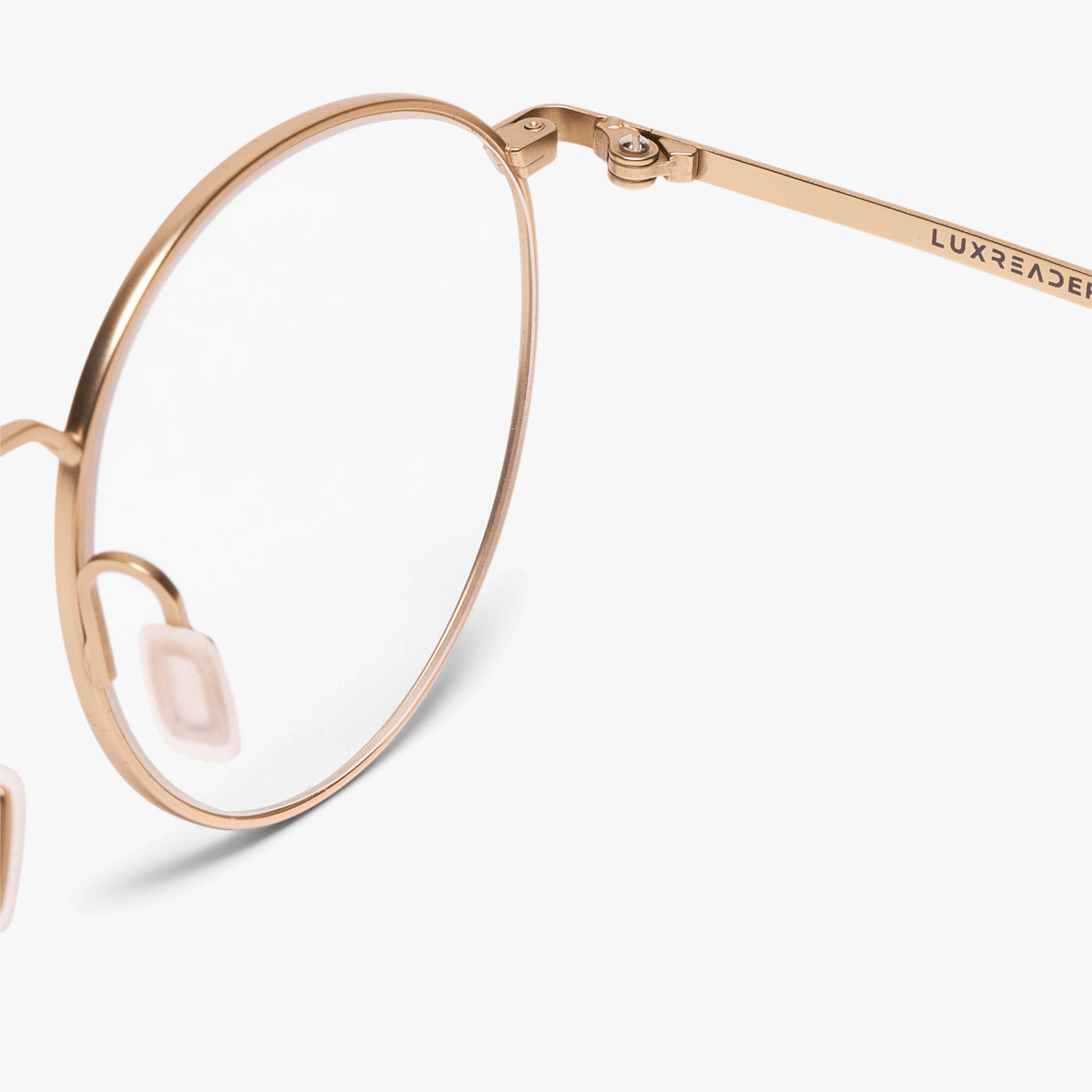 Gold round glasses frame with Luxreaders logo on the temple